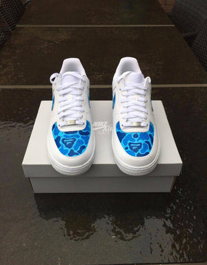 Hypebeast streetwear brand Bape sneaker customs, hand painted blue camo design with bape ape on nike air force 1 white