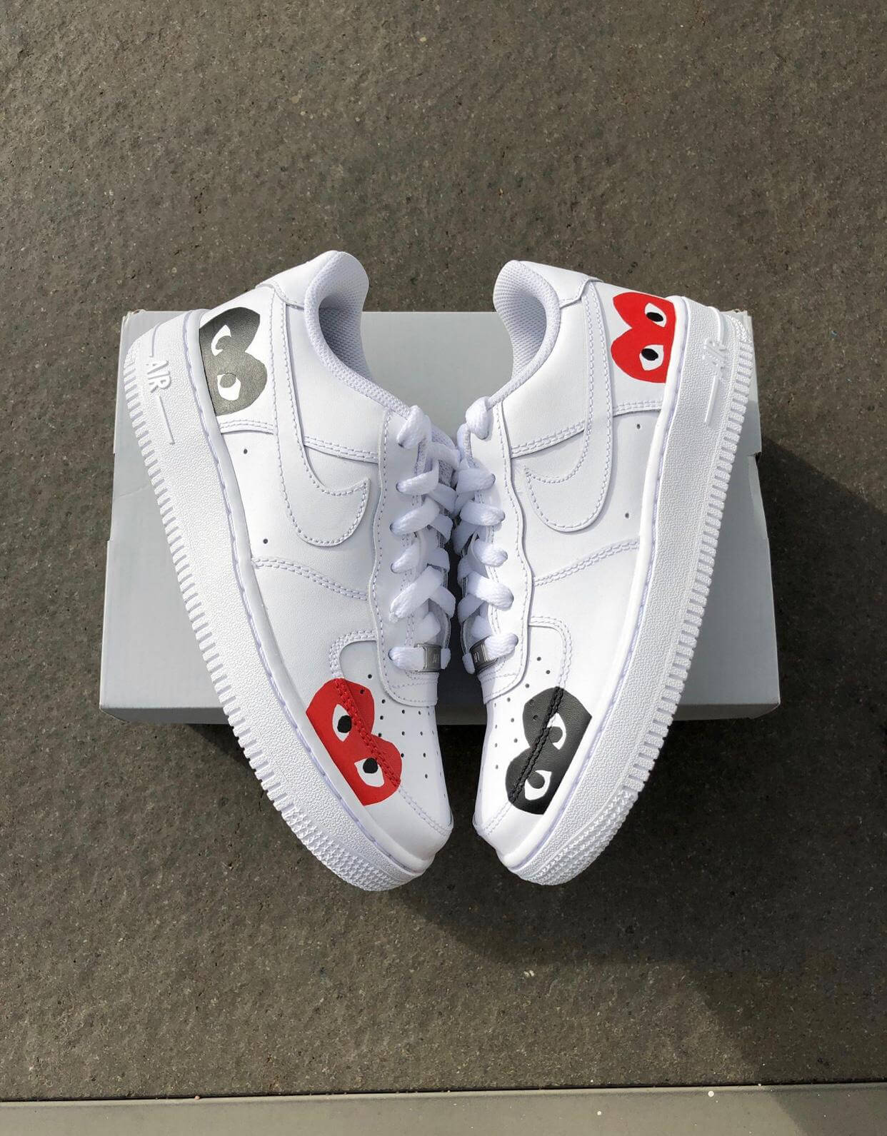 high end designer brand commes des garcon heart hand painted on well known sneaker brand nike sneakers nike air force 1, great for all hypebeasts